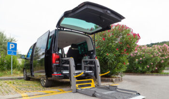 Transport for disabled persons on wheelchair. Accessible car with lift ramp.